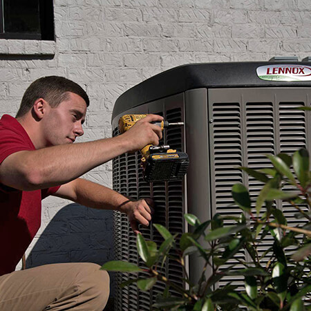Technician Installing an Air Conditioner